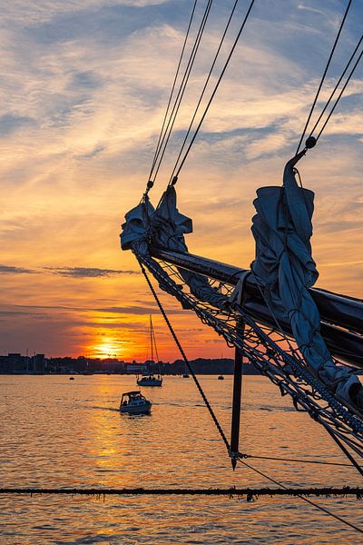 Sailing ships on the Warnow at sunset during the Hans by Rico Ködder
