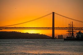 the port of Lisbon at sunset by Leo Schindzielorz