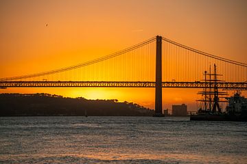 the port of Lisbon at sunset by Leo Schindzielorz