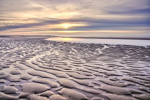 Wolken über der Nordsee mit einem Sonnenuntergang