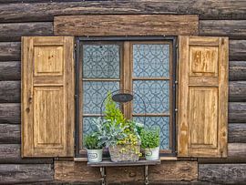 Old window on farmhouse made of wood by Jörg B. Schubert