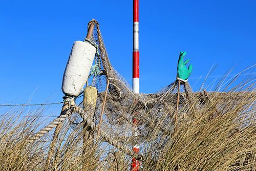 Beach still life with trash / beach jute items by an old fishing net