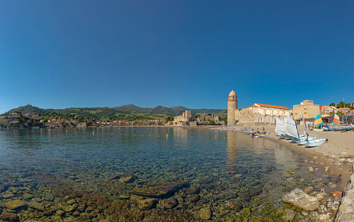 Saint Vincent beach, small sailing boats, the old lighthouse and Anse de la Baleta bay, Collioure, P by Rene van der Meer