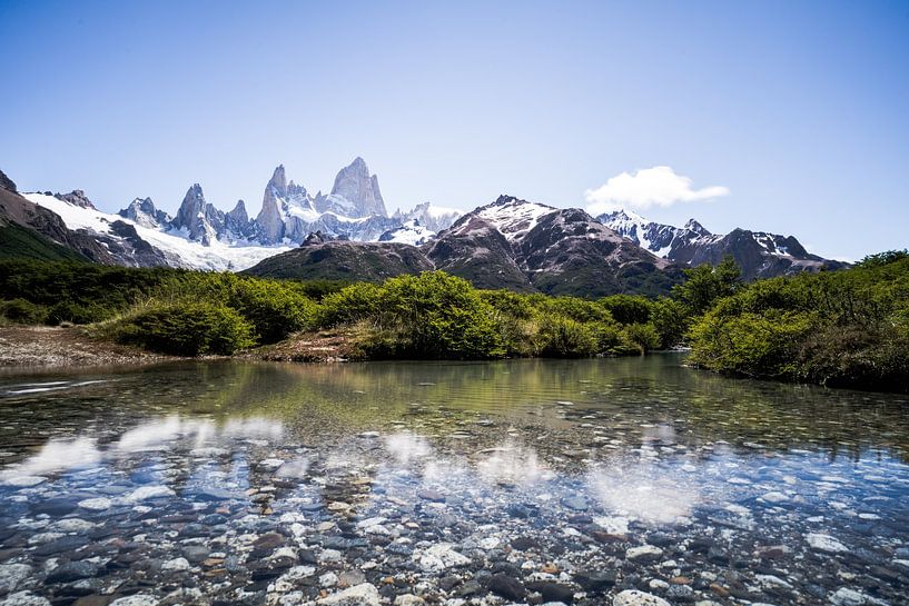 Crystal clear river with view of the Andes by Shanti Hesse