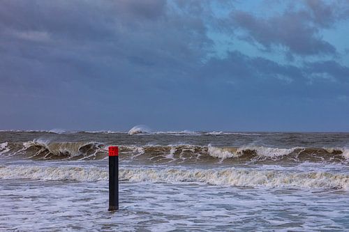 Beach post 13 in the storm and high tide
