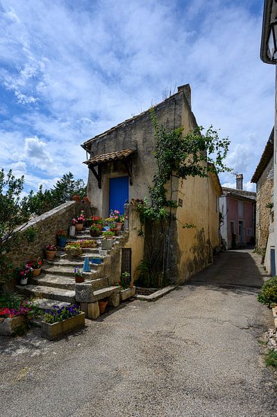 Cottage with long stone staircase full of flowers by Peter Bartelings
