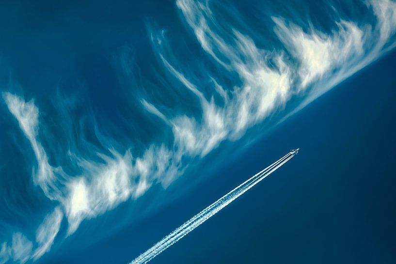 Airplane vs Blue Sky and Clouds by Patrick Ouwerkerk