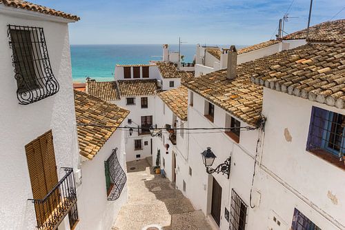 White houses in a narrow street in the historic centre of Altea