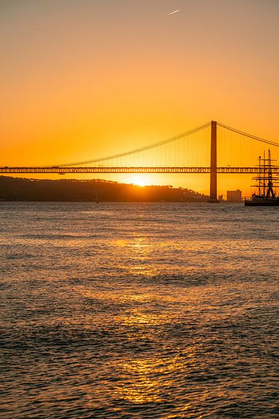 the port of Lisbon at sunset by Leo Schindzielorz