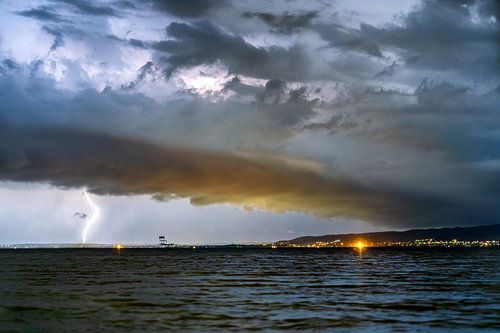 Lightning and thunderstorms at Lake Balaton in Hungary. Evening night. View of Keszthely
