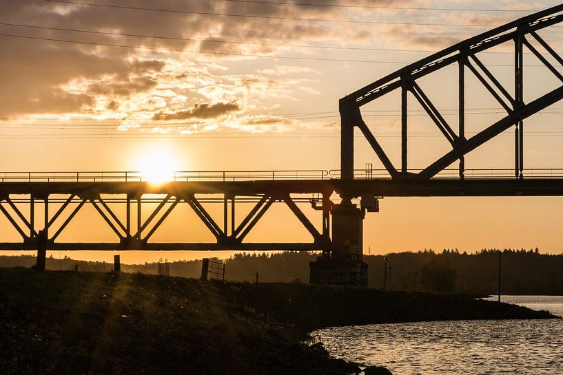 silhouette of a bridge during sunset by Patrick Verhoef