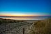 Strandopgang en zee en zon van Peter Sneijders
