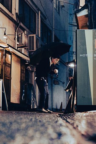Japanese man in front of vending machine