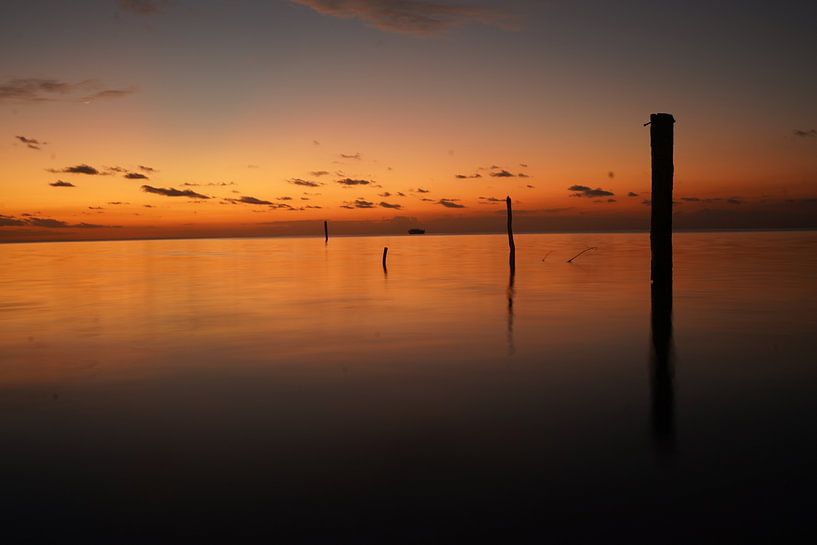 the silence of the water with a setting sun by Diana Stubbe