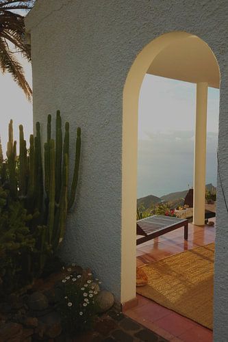 Golden hour magic: The ocean's glow and mountain's embrace