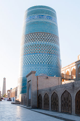 Turquoise mosaic tower during sunrise | travel photography print | Khiva Uzbekistan