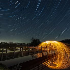 Star trails and sparks on the Hay Bridge by Ruud Engels
