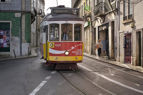 Tram 28 in the golden backlight - street scene from Lisbon