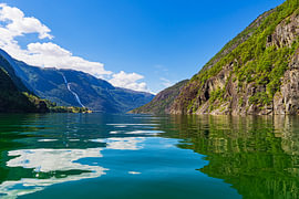 View of the Langfossen waterfall on the Åkrafjord in Norway by Rico Ködder