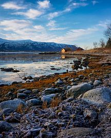 Fishing hut along a fjord in winter, Ålesund, Norway by qtx