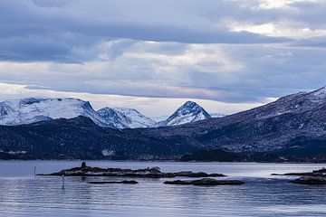 Mountains and rocks in winter near Torvik in Norway by Rico Ködder