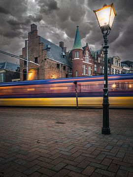 The streetcar passes by in The Hague with the prison gate in the background