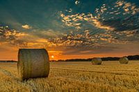 Straw bales during sunset