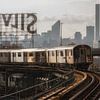 Train No.7 In Queens With The Manhattan Skyline by Nico Geerlings