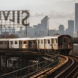 Train No.7 In Queens With The Manhattan Skyline by Nico Geerlings