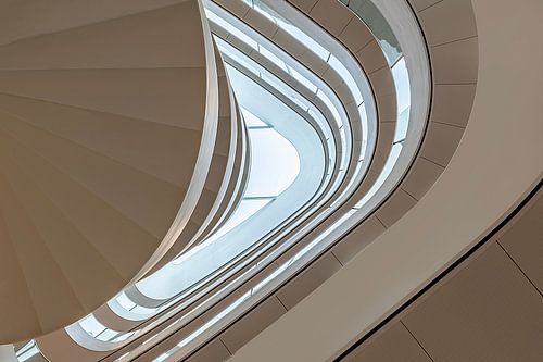 Looking up at a spiral staircase in a building
