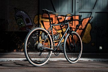 Gravel bike in abandoned barn by Tijn Betten