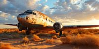 Abandoned plane in the desert at sunset