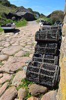 Baskets and utensils of fishermen on dry land in the sun
