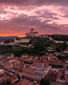 Trencin Castle above the town at sunset by Ewold Kooistra