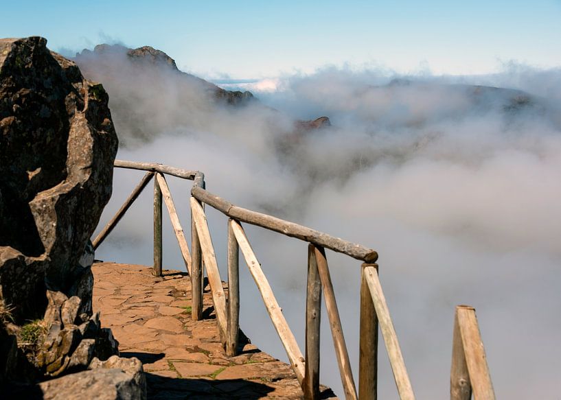 walkway with wooden railings at a great height at mountains at madeira island called pico arieiro, t by ChrisWillemsen