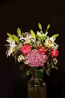 A bunch of flowers on a black background