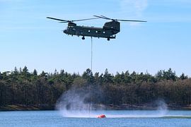 Helicopter with water bucket for wildfire fighting by Sjoerd van der Wal Photography