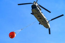 Helicopter with water bucket for wildfire fighting by Sjoerd van der Wal Photography