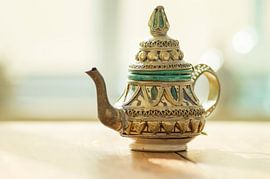 In oriental atmosphere ( oriental coffee pot/teapot in pastel colours)