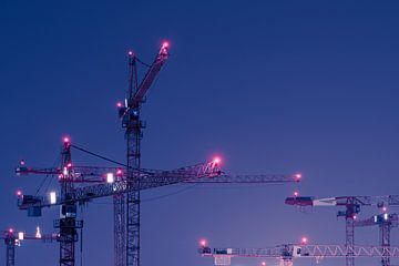 Tower cranes at night by Robert Ruidl