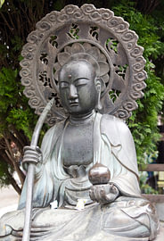 Buddha with a parasol by Patricia Hofmeester