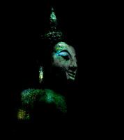 Buddha head in green, blue and turquoise