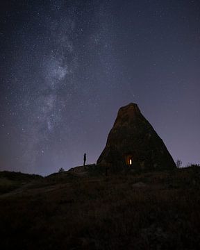 Starry sky above a rock dwelling in Turkey by Ewold Kooistra