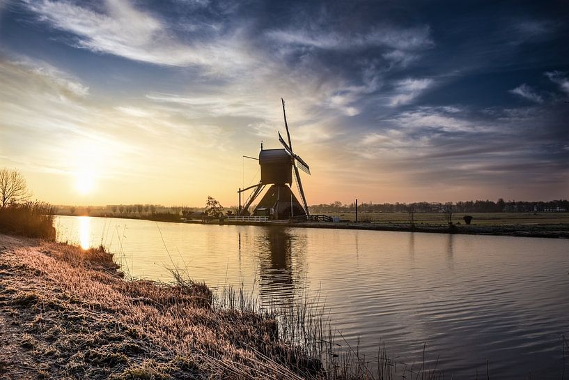 Windmill at the waterfront near Kinderdijk by Rowan van der Waal