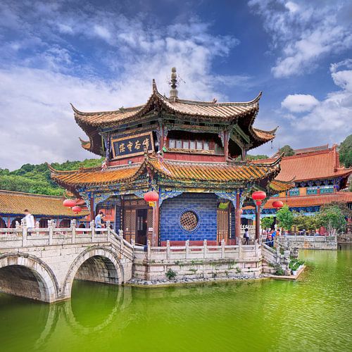 Yuantong Temple against a blue sky with dramatic clouds