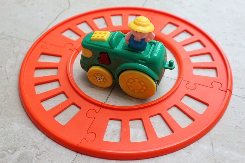 Toy train track with train next to track by hou2use