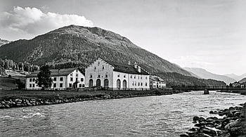 Alpine Farm Buildings And River In The Engadin Mountains