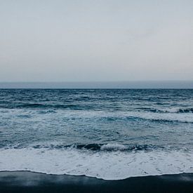Black beach, blue sea and white waves in Tenerife by Yvette Baur