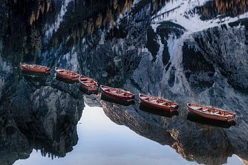Wooden boats on the lake in the Alps