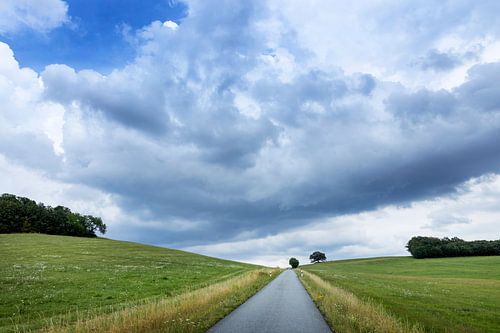 Rolling countryside and country road in Saxony Germany